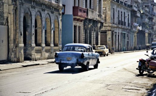 Old car driving through streets of Havana, Cuba