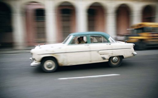 Old American sedan driving through Havana,Cuba